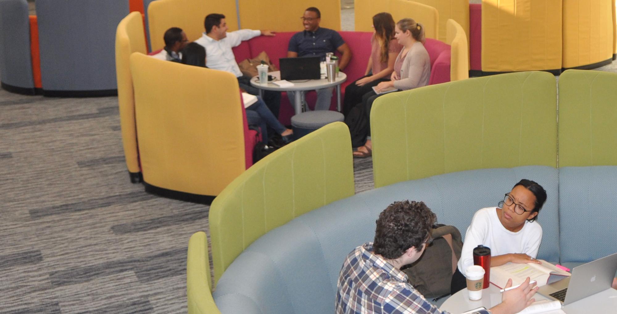 Students in learning commons in discussion